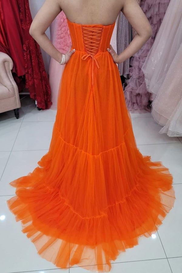Back view of a sweetheart strapless tulle corset prom dress.