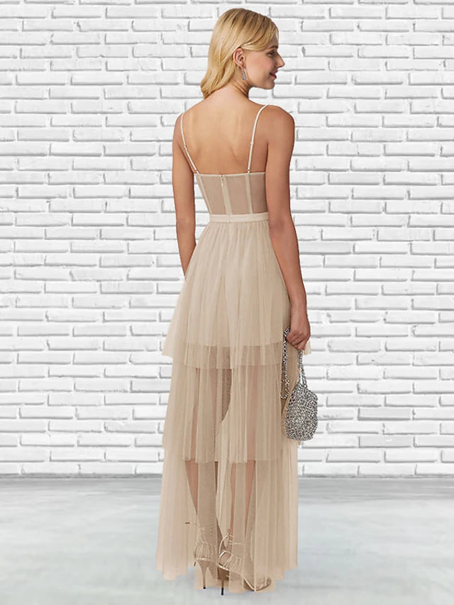 Side view of a voluminous floor-length tulle ball gown, perfect for formal events.