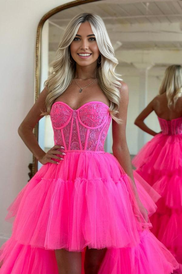Close-up of the tiered skirt and fabric of the hot pink dress.