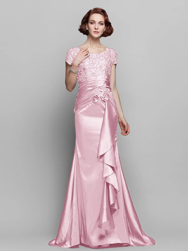 Side view of the mermaid trumpet dress, highlighting the sweep train and short sleeves.