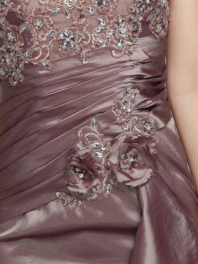 Detail of the short sleeves and illusion neckline on the mother of the bride dress.