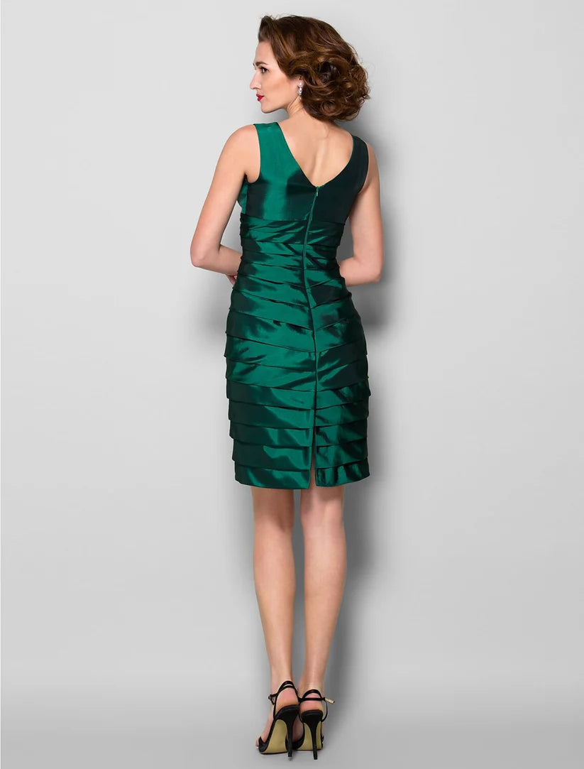 Back view of the purple taffeta sheath dress, showcasing criss-cross ruching details.