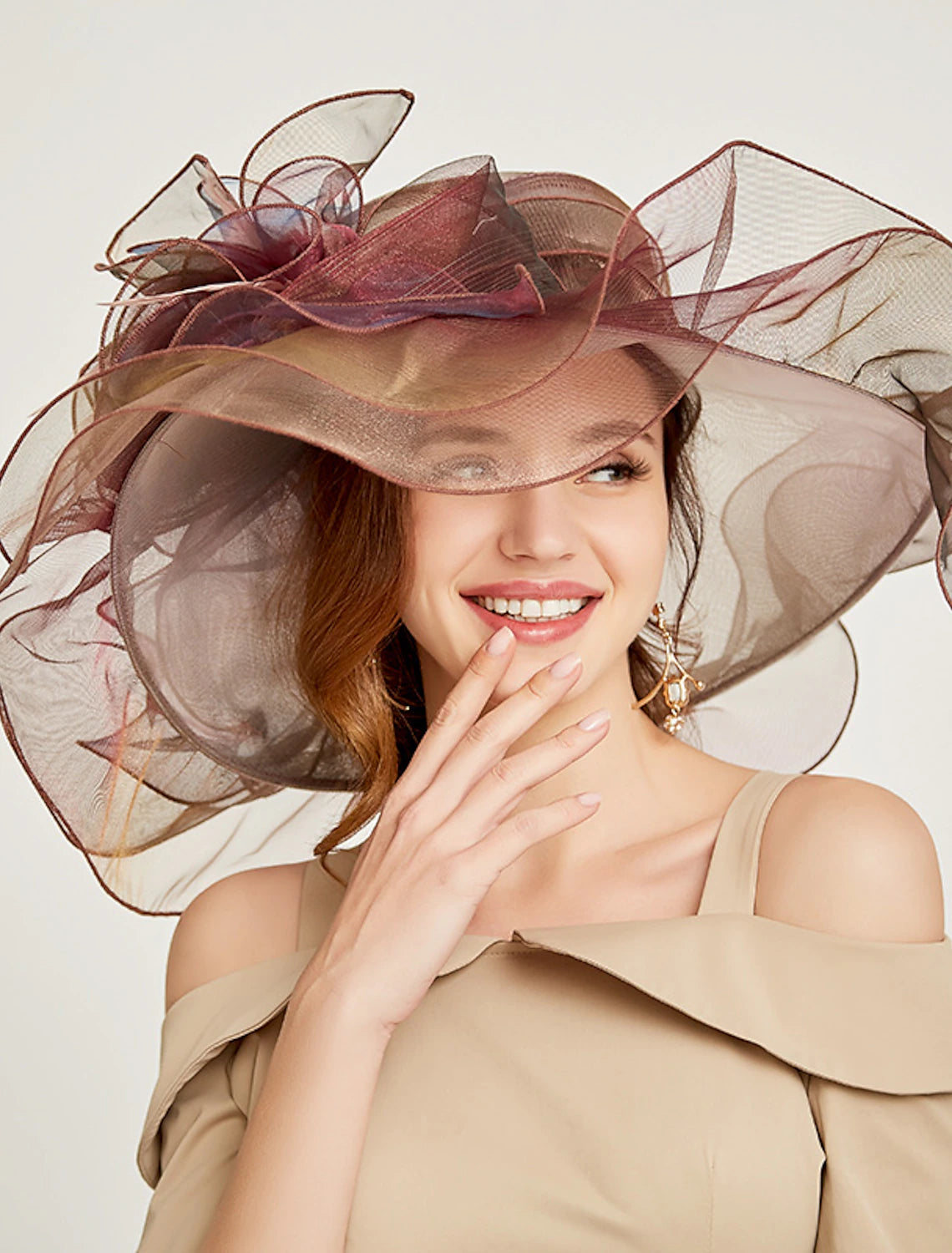 Stylish organza fascinator headpiece with layered ruffles.