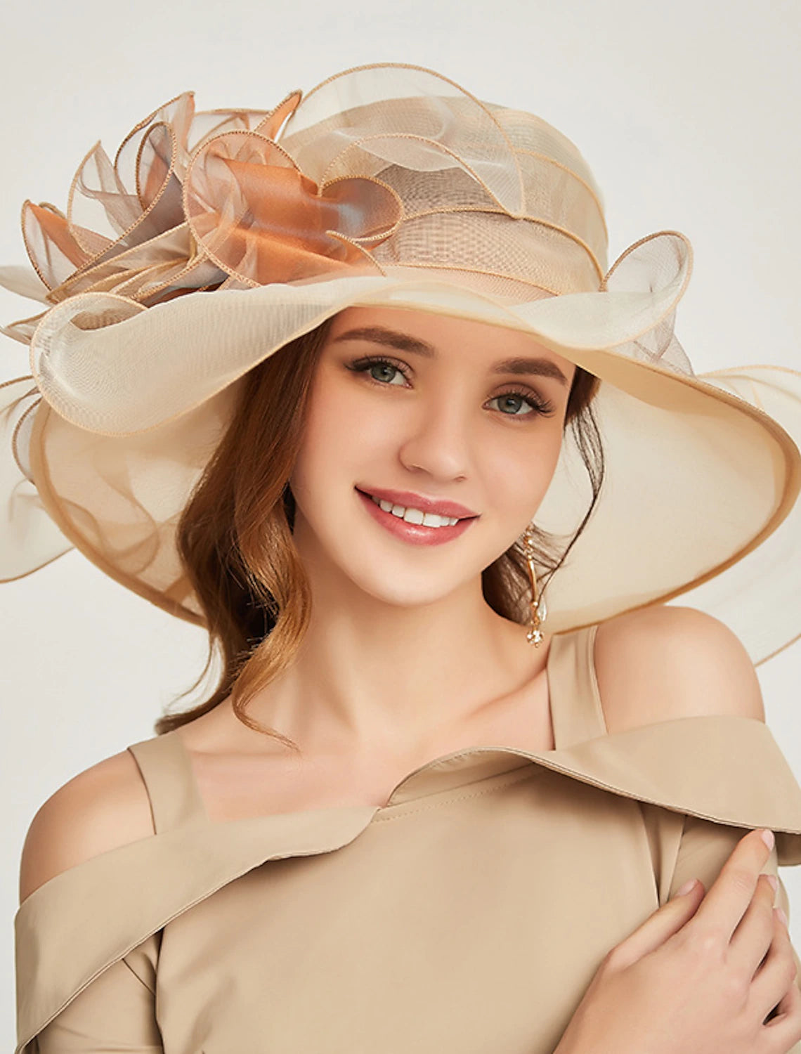 Fashionable organza hat for weddings and special events.