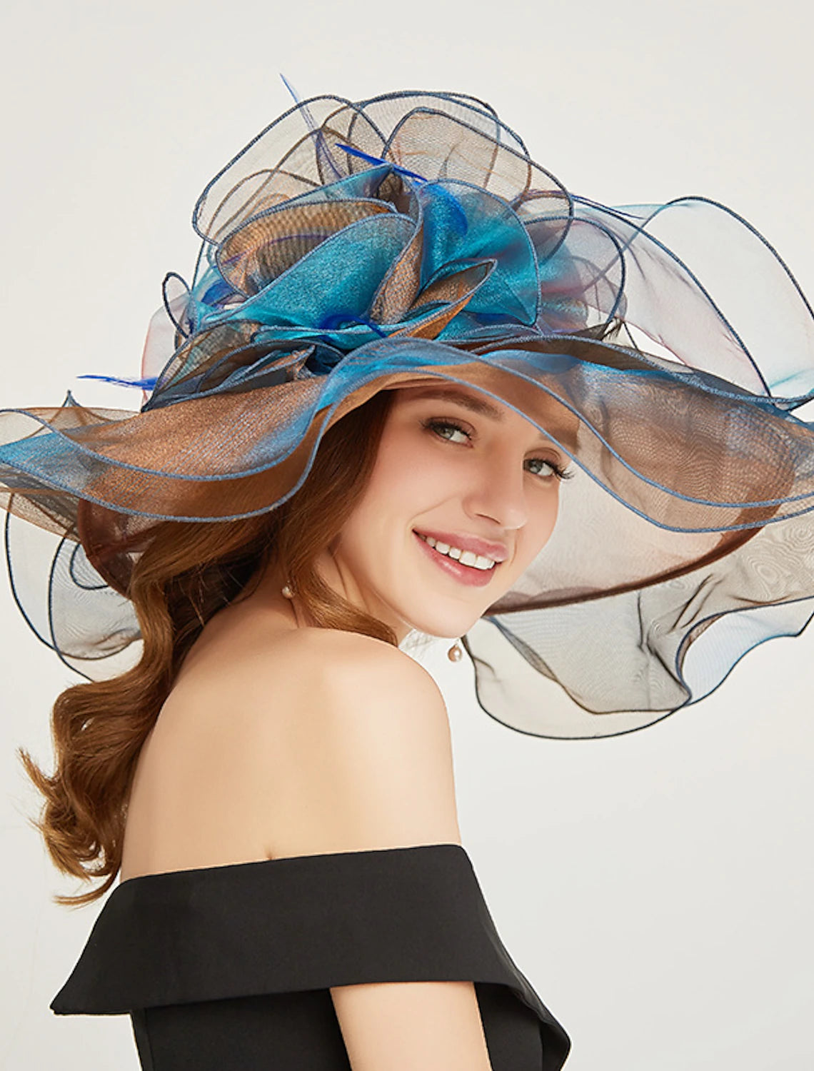 Sophisticated organza fascinator in a tiered style.