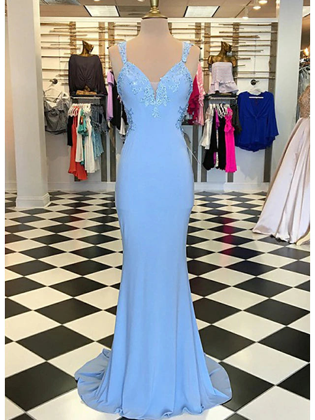 Elegant trumpet mermaid prom dress with a scalloped neckline and appliqued details.