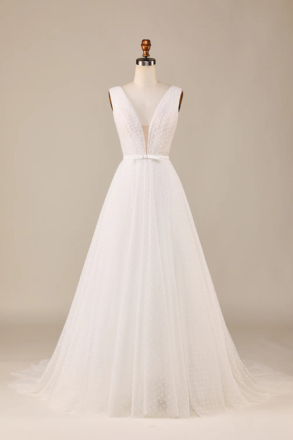 Elegant ivory tulle A-line wedding dress with deep V-neck and bowknot detail, front view.