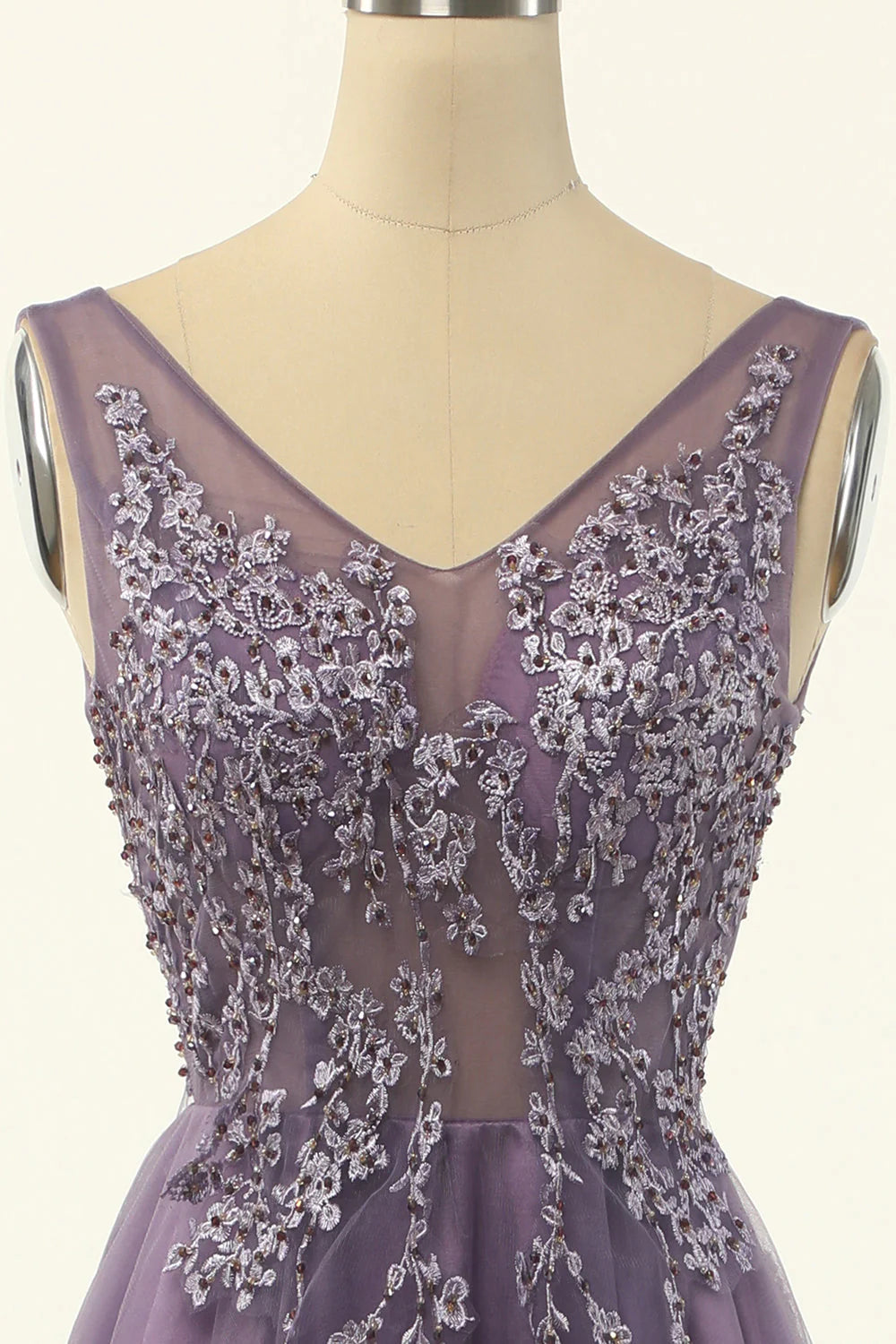 Side view of purple tulle A-line prom dress.