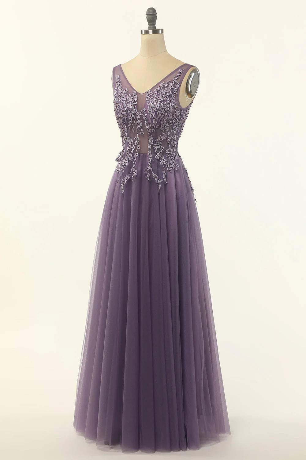 Close-up of purple tulle fabric on A-line prom dress.