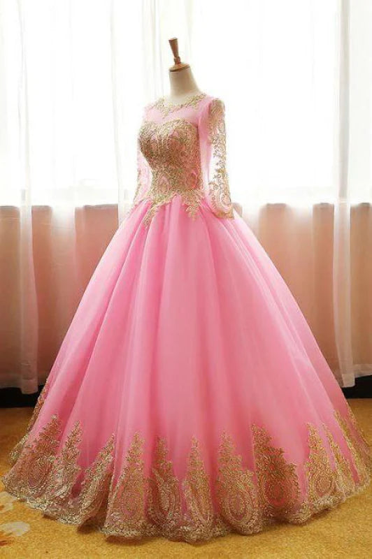 Side view of the light pink ball gown, highlighting the full silhouette and appliques.