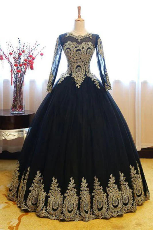Elegant tulle ball gown with long sleeves and lace appliques.