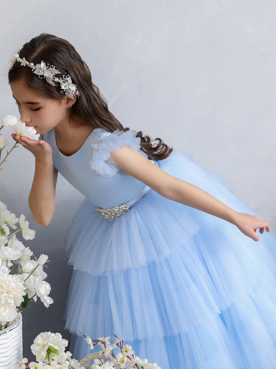 Side view of the tiered pleats on the tulle ball gown flower girl dress.