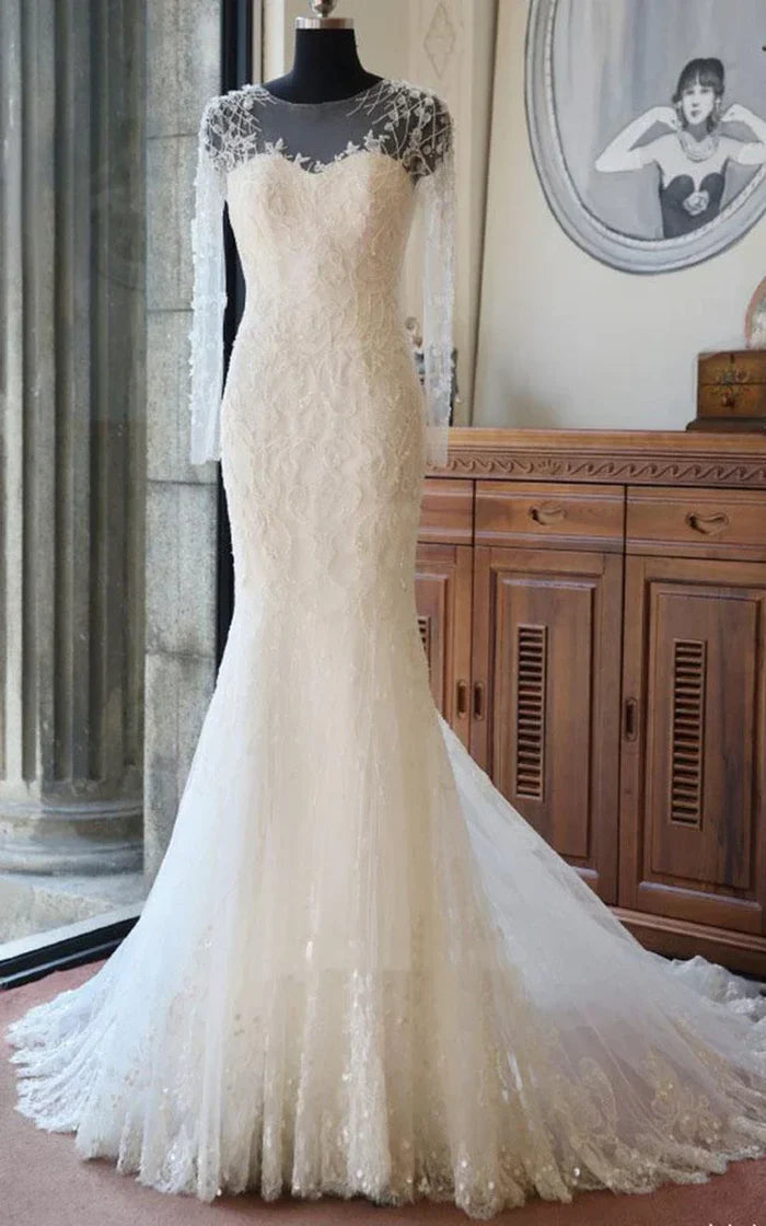 Full view of an elegant long sleeve tulle lace satin gown with beading.