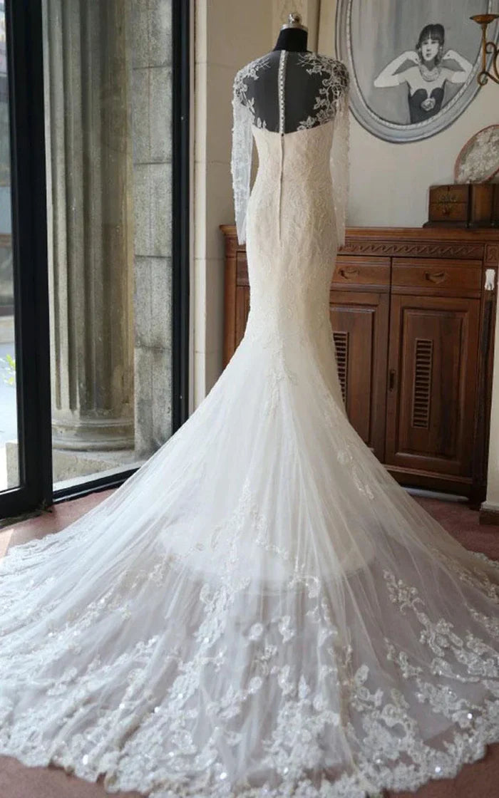 Close-up of the intricate lace and floral beading on the satin gown.