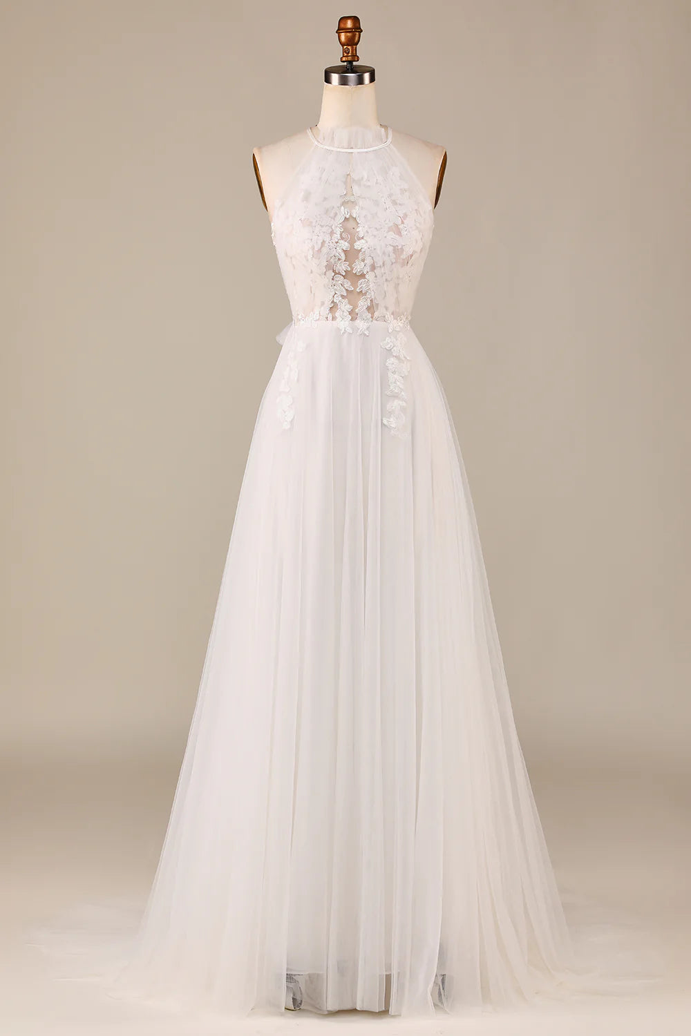 Elegant ivory tulle and lace wedding dress with an open back and sweep train.