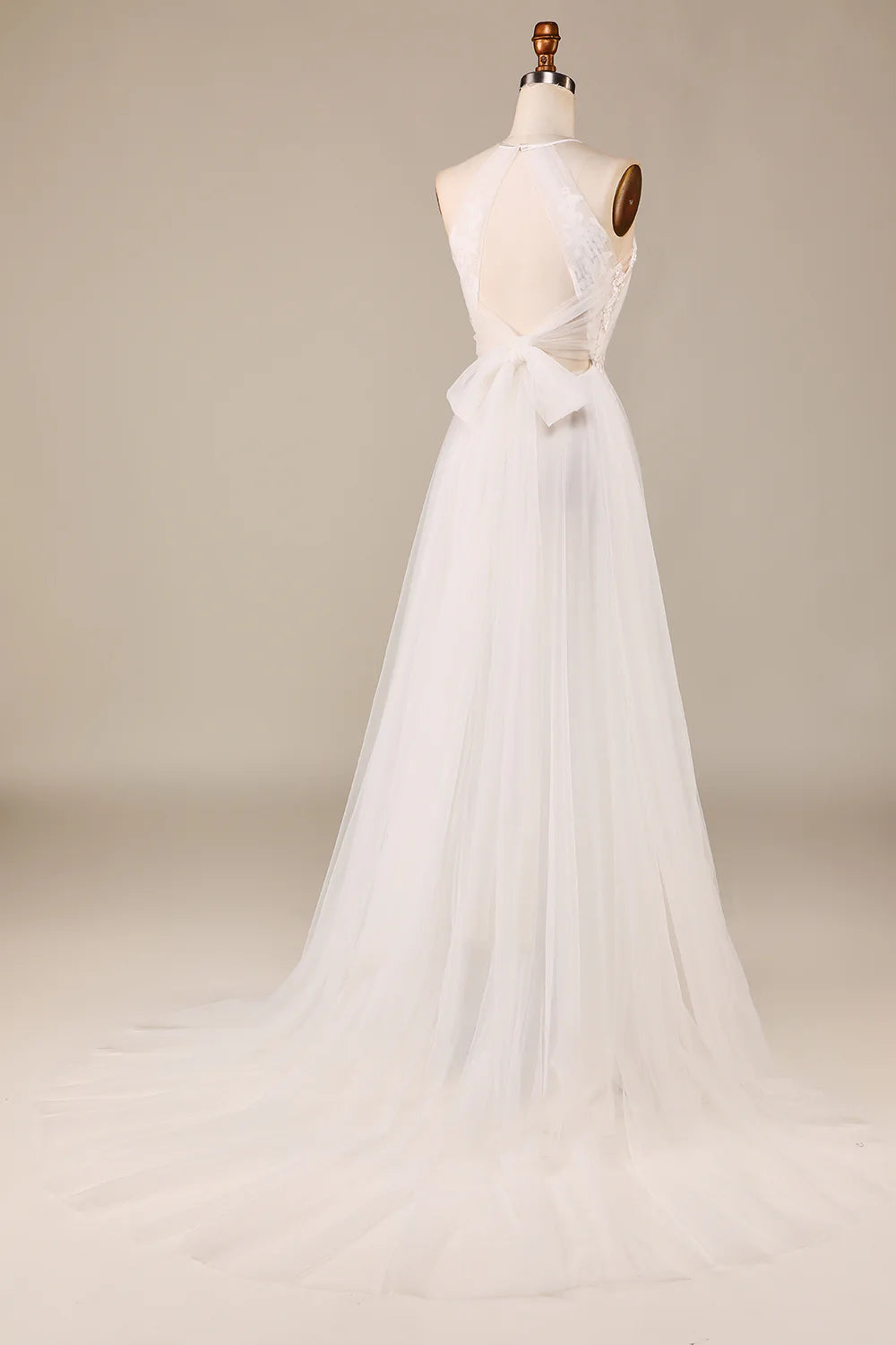 Close-up of the delicate lace detailing on the bodice of the wedding dress.