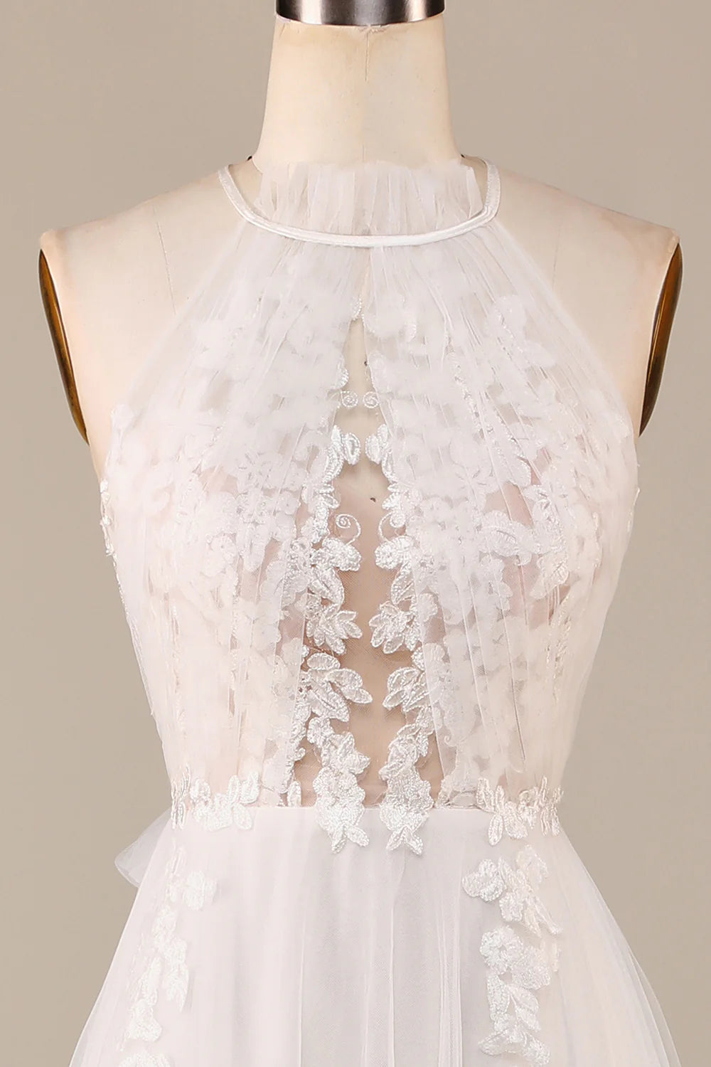 Back view of the bridal gown showcasing the open back and flowing sweep train.