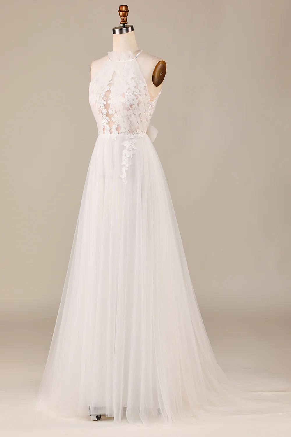 Full length view of the tulle wedding dress, highlighting its graceful silhouette.