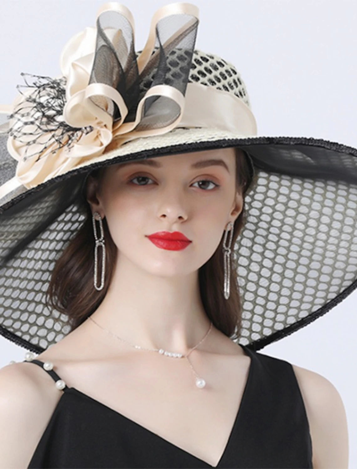 Back view of the beige tulle organza hat, highlighting the headpiece design and fabric texture.