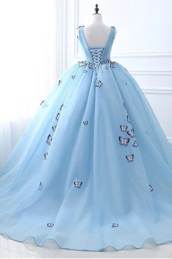 Back view of a white tulle prom dress featuring delicate butterfly details.