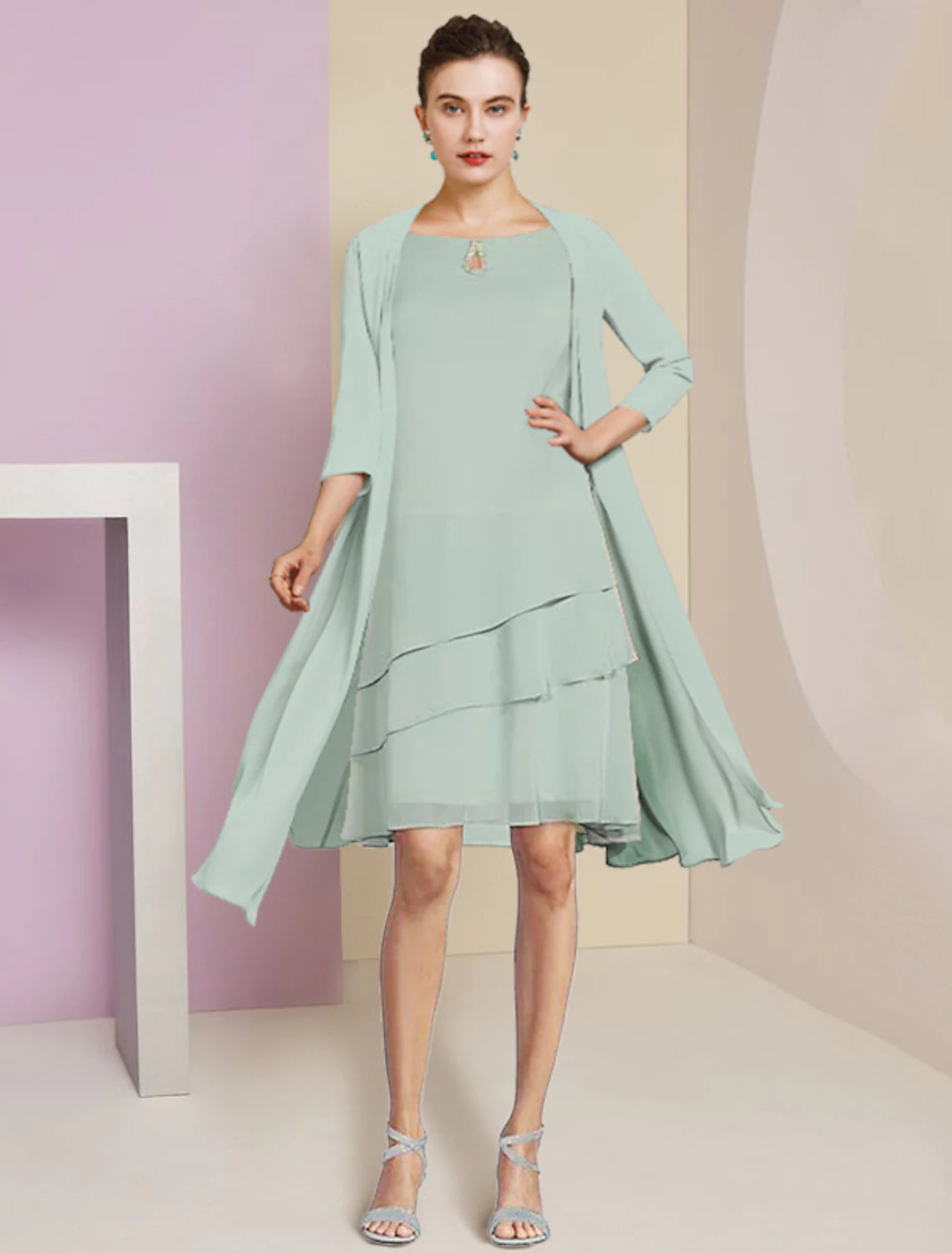 Close-up of the scoop neck and tiered detail on the chiffon dress.