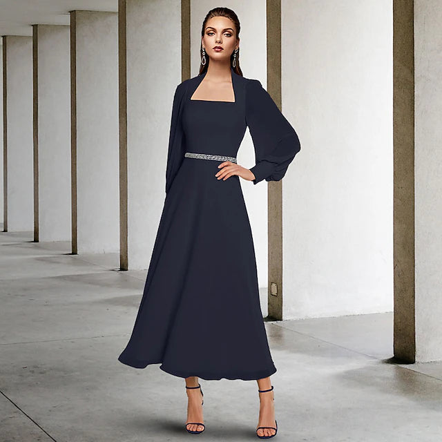 Back view of the two-piece A-line chiffon dress, showing the flowing tea length skirt.