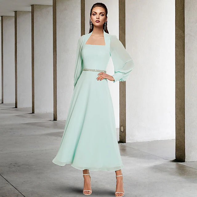 Side view of the elegant Mother of the Bride dress, highlighting the included wrap and sash.
