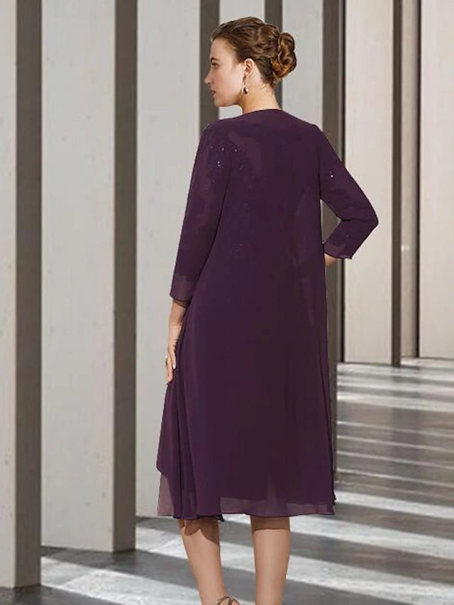Side view of the knee-length Mother of the Bride gown, showing the flow of the chiffon skirt.