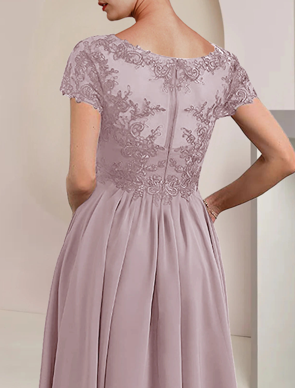 Detail of the short sleeve and V-neckline on the formal dress.