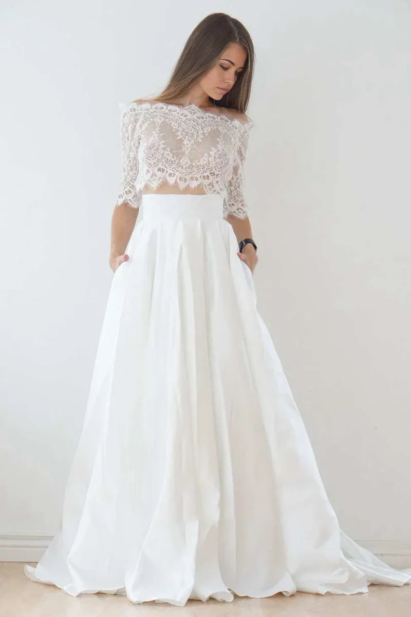 Close-up of the delicate lace bodice and off-shoulder detail of the wedding gown.