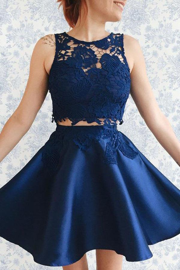 Dark blue two-piece satin homecoming dress with lace appliques.