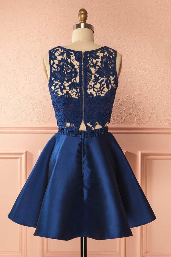 Back view of a dark blue two-piece satin homecoming dress.
