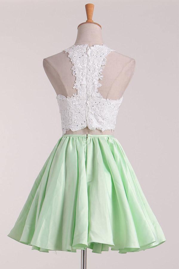 Back view of the two-piece A-line satin homecoming dress.