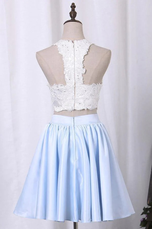 Close-up of applique detail on the two-piece satin dress.