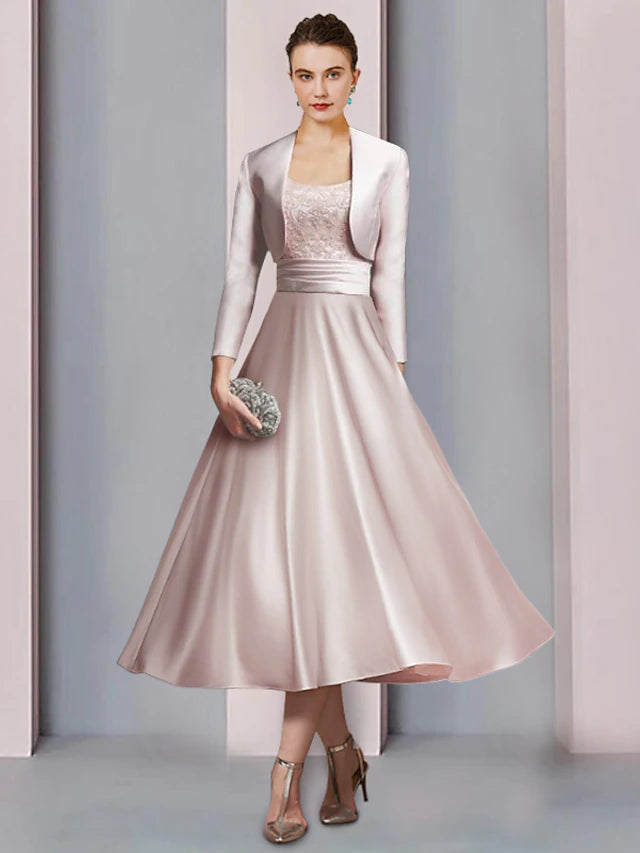 Elegant two-piece A-line Mother of the Bride dress with scoop neck and half sleeves.