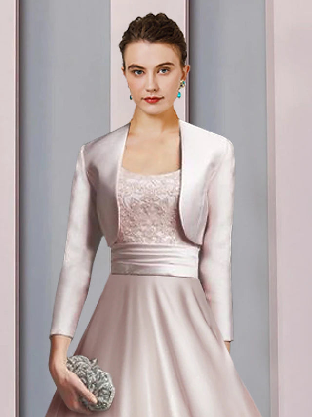 Tea length two-piece A-line dress featuring satin lace and appliques.