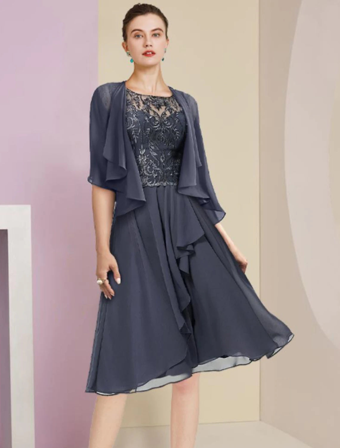 Elegant two-piece A-line mother of the bride dress with scoop neck and short sleeves.