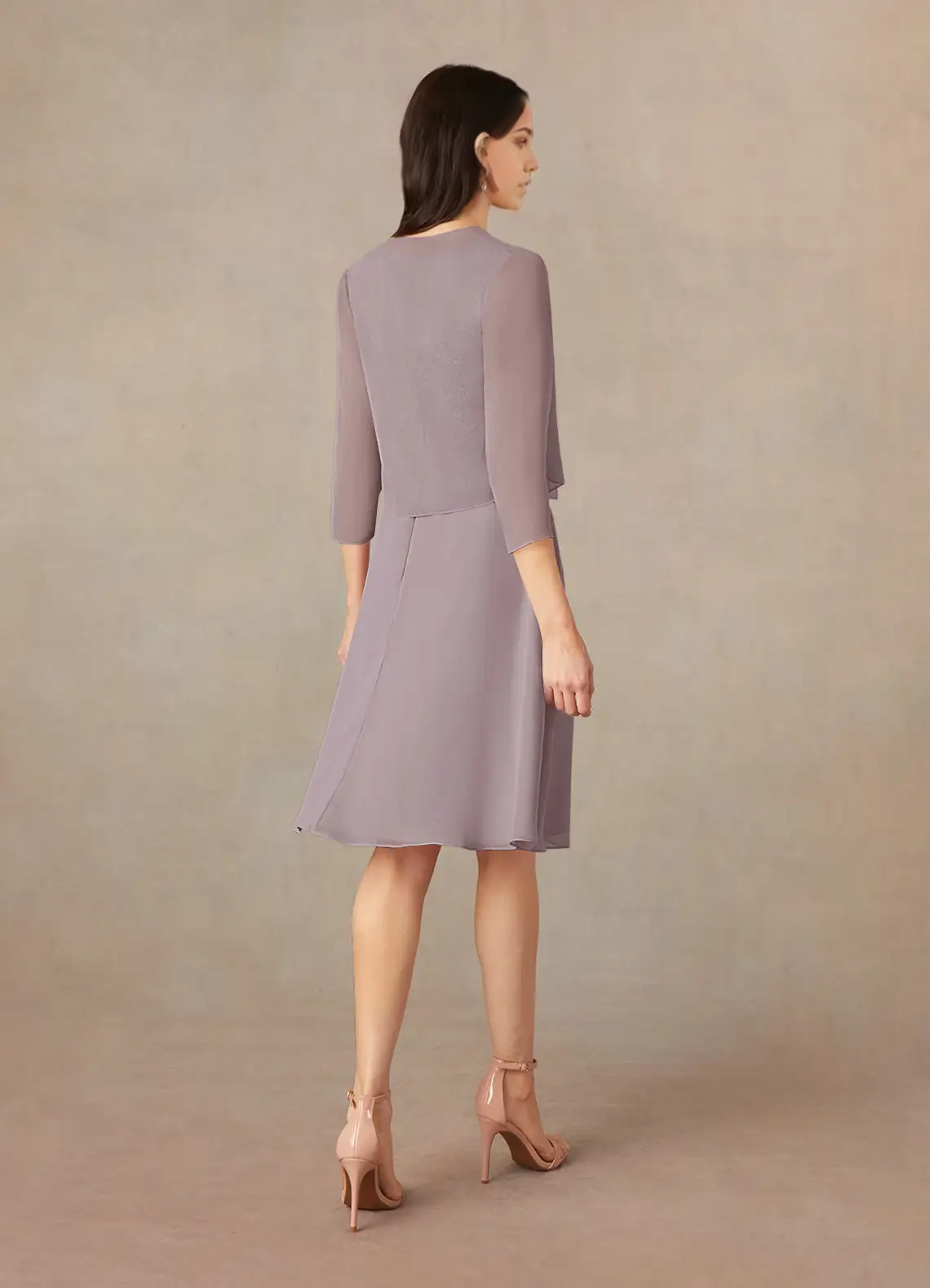Back view of the two-piece A-line formal dress with flowing chiffon skirt.
