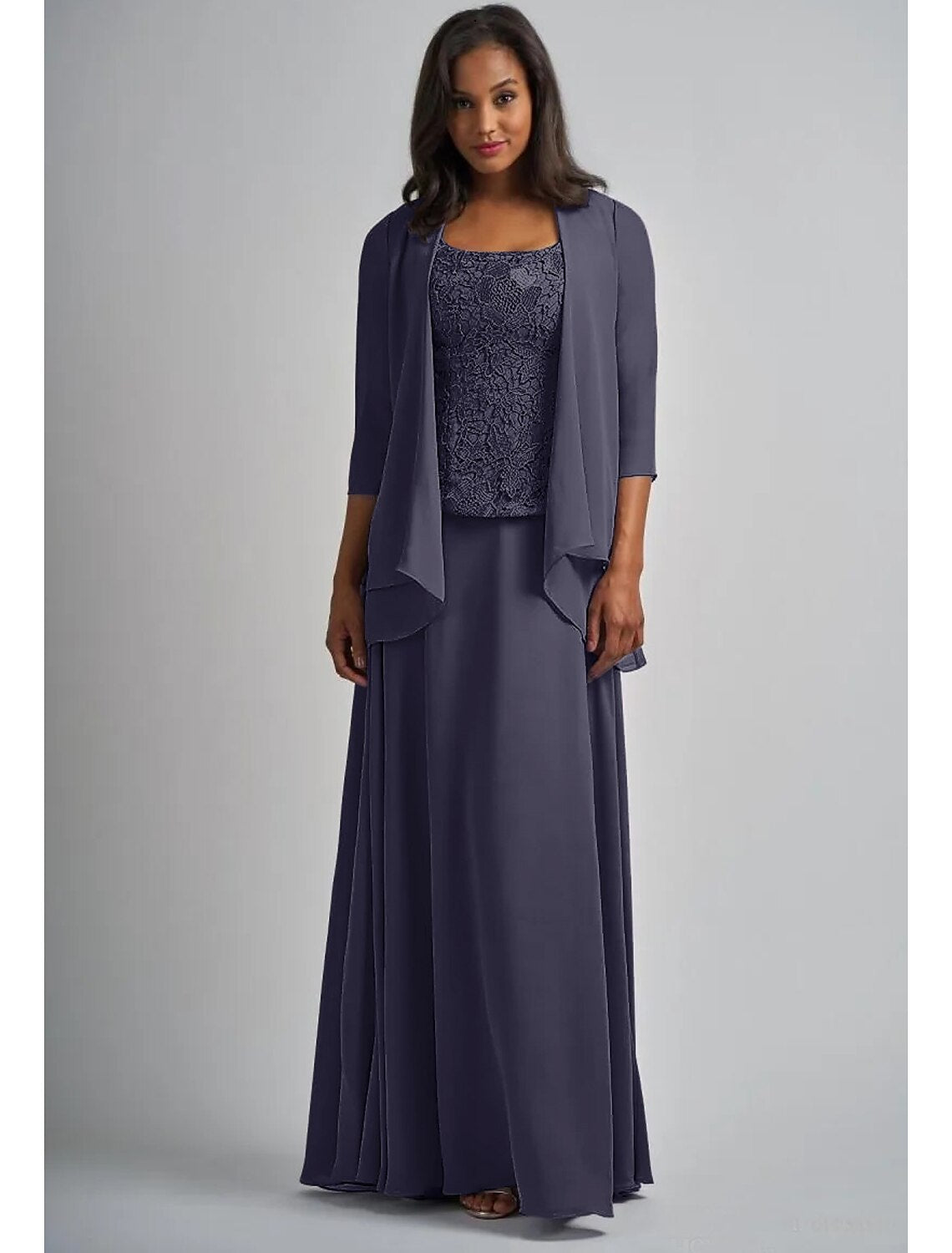 Two-piece A-line Mother of the Bride gown, showing the flowing chiffon skirt and lace details.