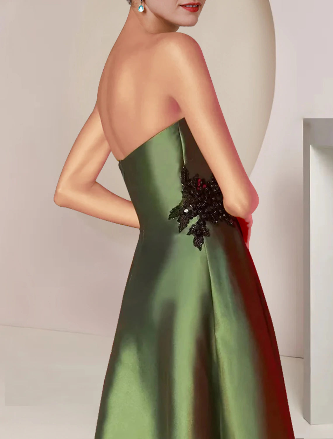 Back view of the two-piece A-line mother of the bride dress, showcasing the tea length and flowing skirt.