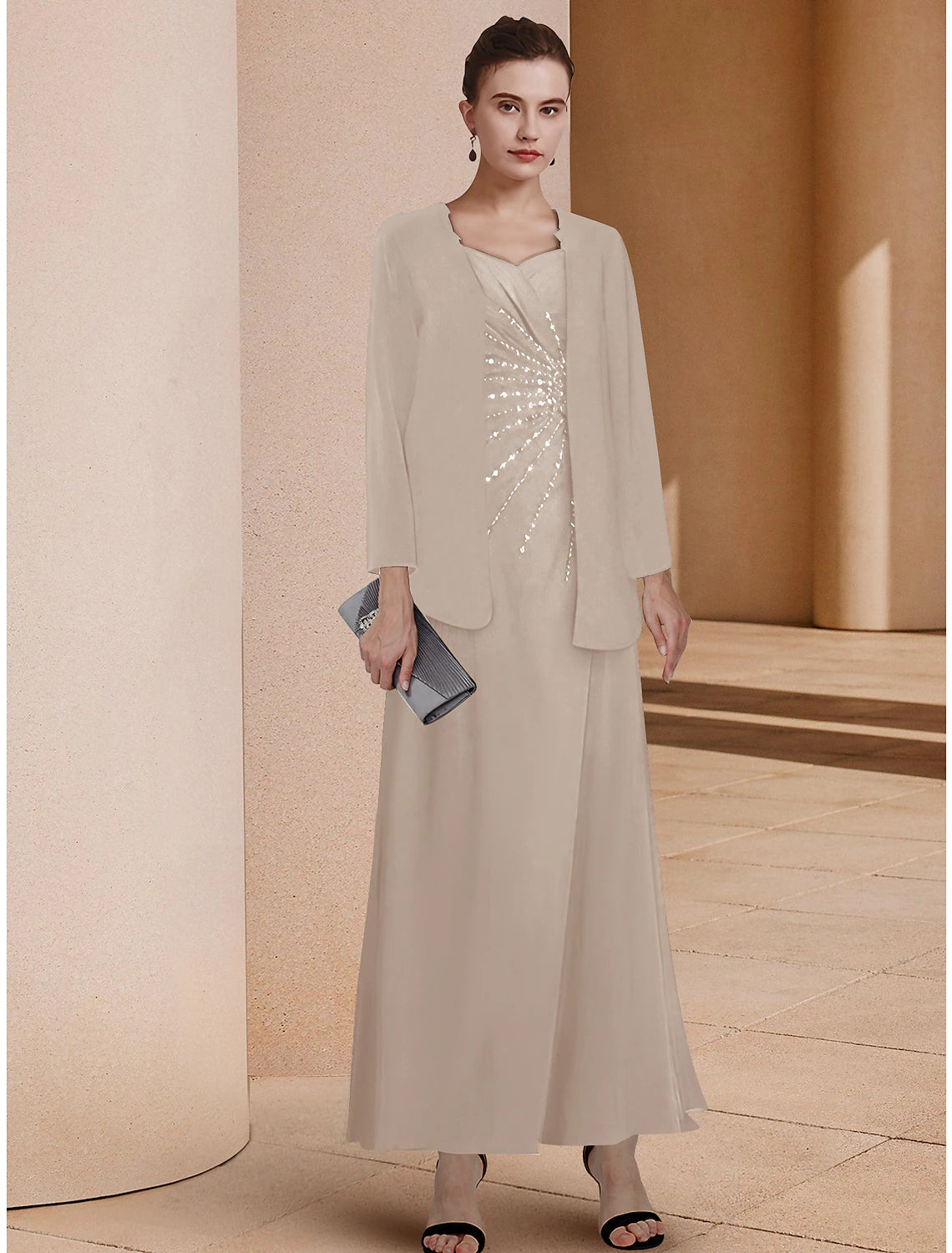 Elegant two-piece A-line mother of the bride dress with sweetheart neckline and 3/4 sleeve jacket.