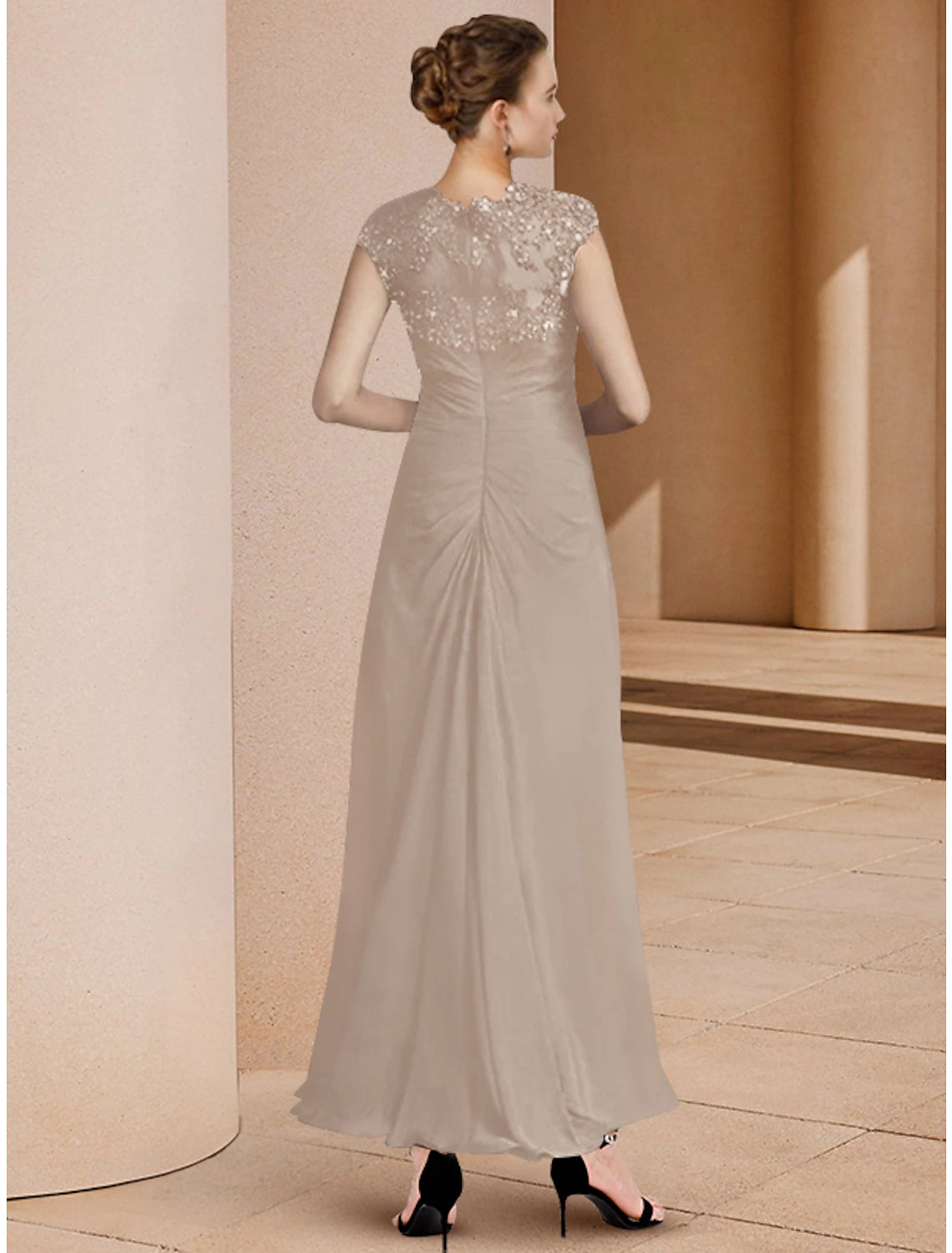 Close-up of the sequin and lace detail on the two-piece formal gown.