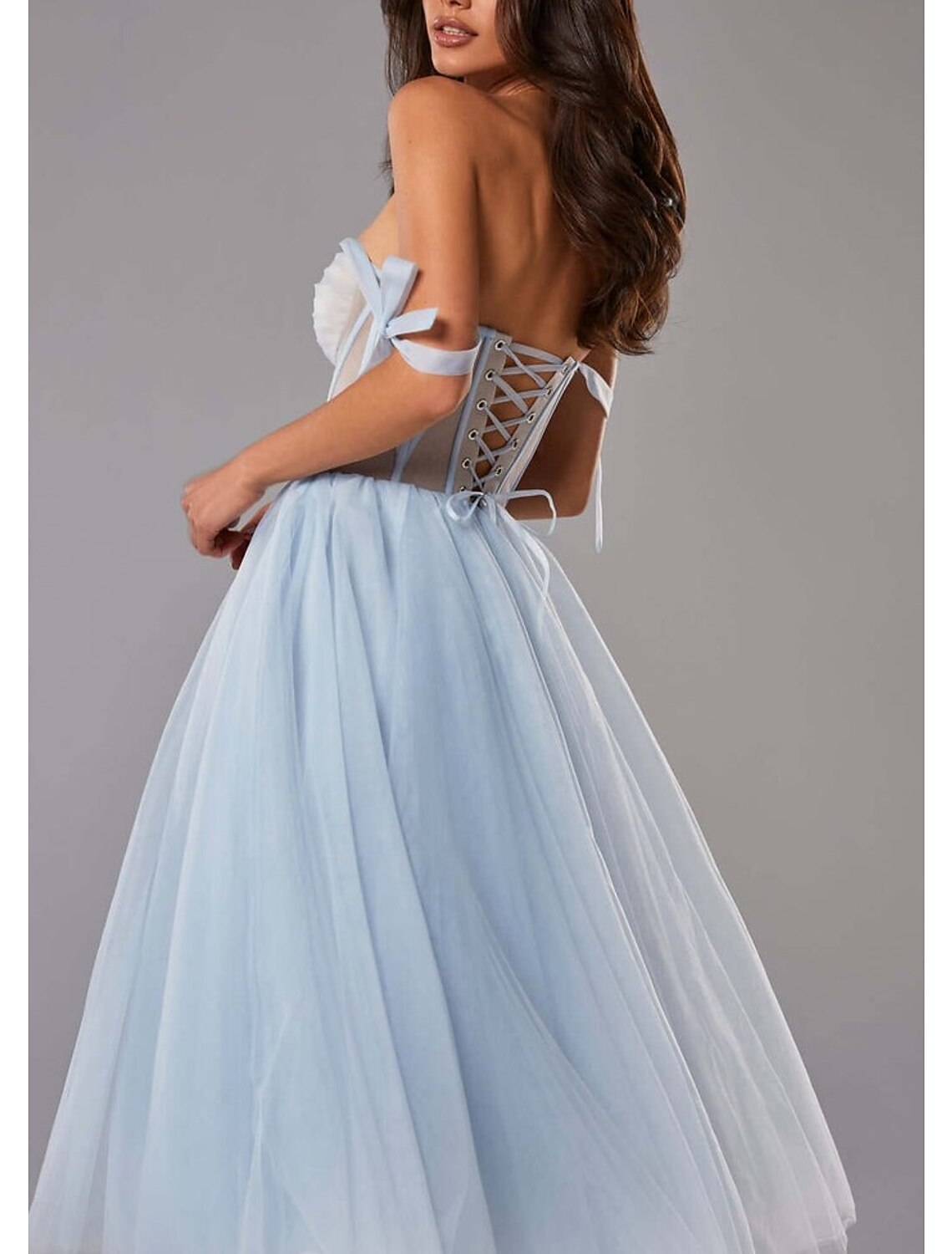 Side profile of the elegant A-line silhouette dress.