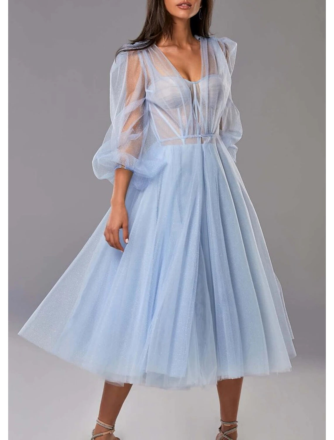 Full view of the two-piece formal gown with pleated tulle.