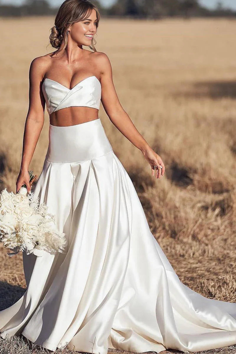 Elegant two-piece A-line sweetheart satin wedding dress, front view.