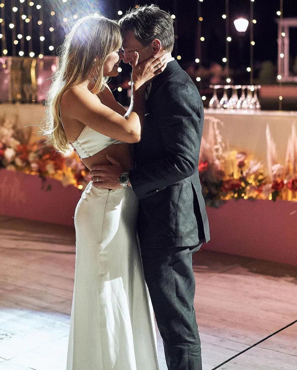 Full length view of the two-piece A-line satin wedding dress, showing the flowing skirt.