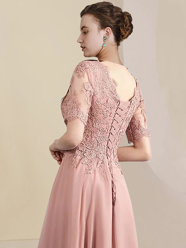 Close-up of the delicate lace appliques on the two-piece formal dress.