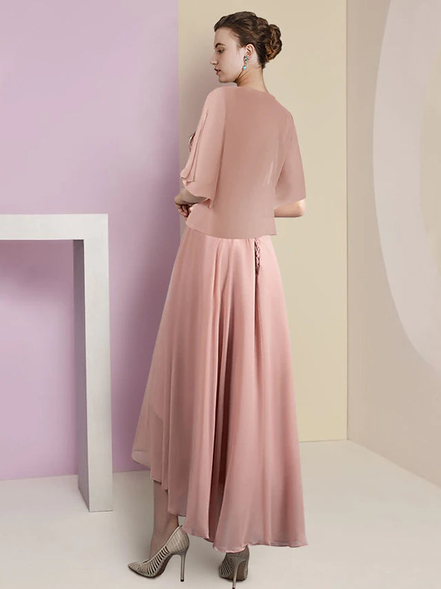 Full length view of the two-piece formal dress, highlighting the asymmetrical design.