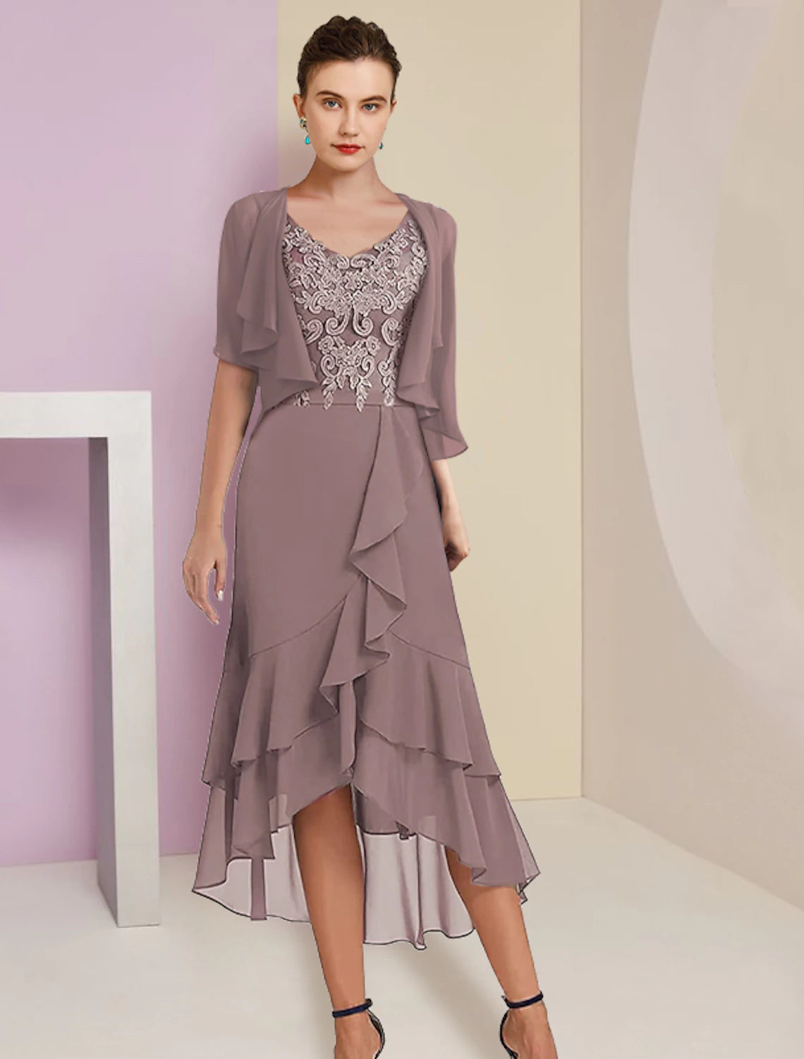 Elegant two-piece A-line mother of the bride dress with V-neck and high-low tea length skirt.