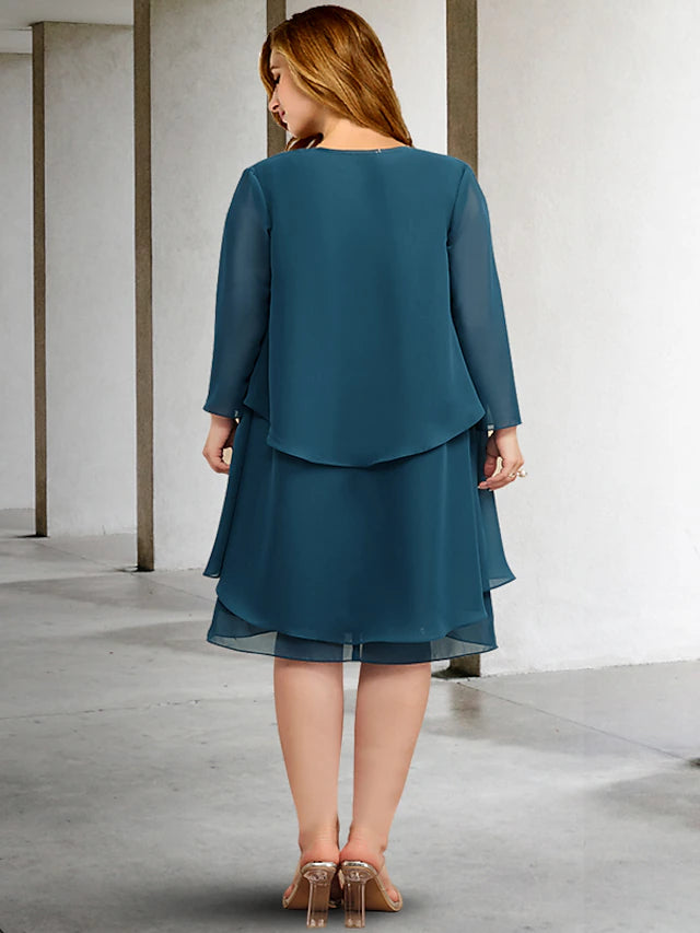 Plus size formal knee-length chiffon dress, side view.